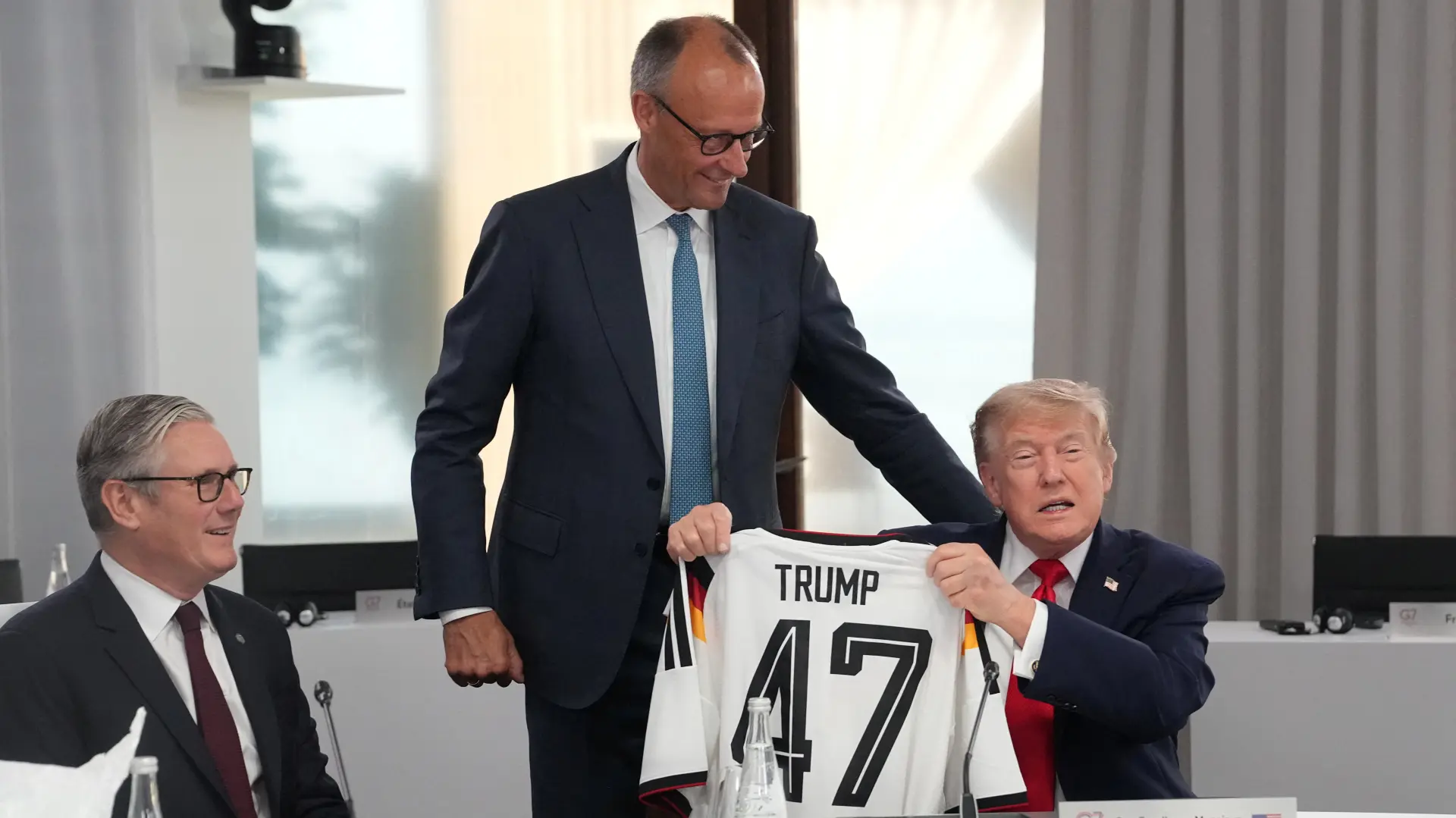 Fridrih Merc i Donald Tramp dres Nemačke samit g7 Švajcarska Thibault Camus Pool via REUTERS-6a317820c2b6c.webp
